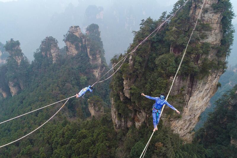 Contestants dressed as characters from the movie 'Avatar' take part in a tightrope walking contest in Wulingyuan Scenic Area of Zhangjiajie, Hunan province, China. Reuters