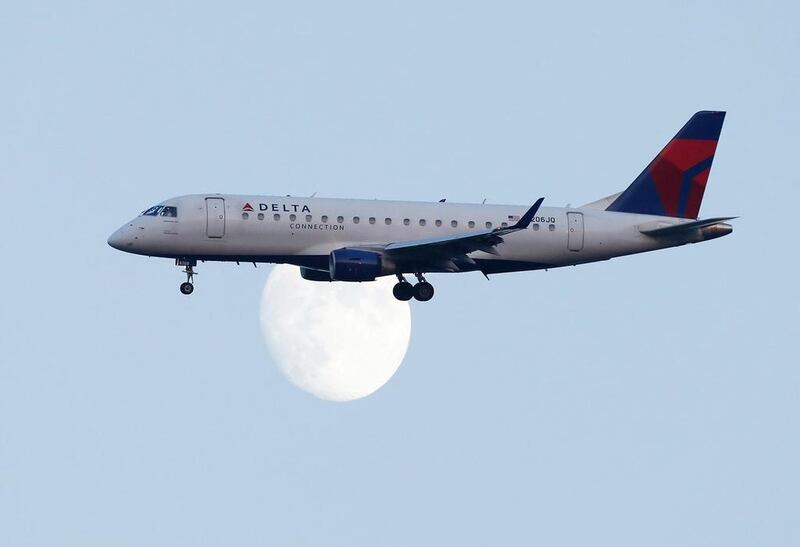 A Delta airlines commuter jet lands at LaGuardia airport in in New York. The biggest three airlines in the US – Delta, United and American – and their unions, want the president Barack Obama’s administration to prevent Gulf carriers from adding extra routes to the US.  Eduardo Munoz / Reuters