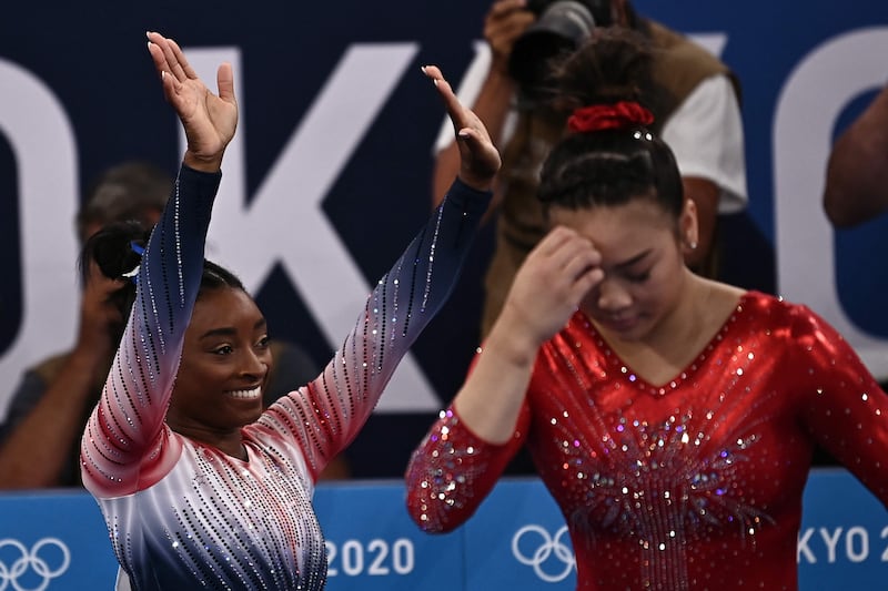 USA's Simone Biles celebrates after competing in the artistic gymnastics women's balance beam final.