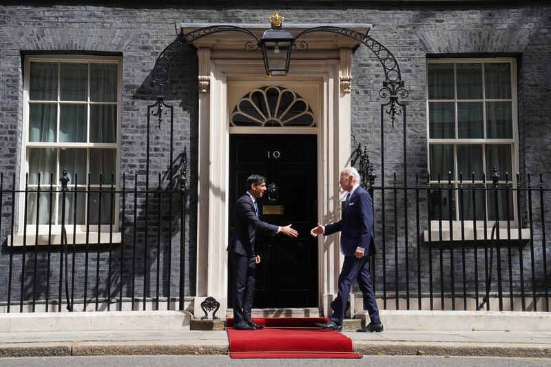 Mr Sunak and Mr Biden shake hands outside 10 Downing Street. PA