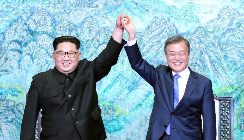 North Korean leader Kim Jong Un (left) and South Korean President Moon Jae-in (right) pose for photographs after signing the Panmunjom Declaration for Peace, Prosperity and Unification of the Korean Peninsula during the Inter-Korean Summit at the Peace House on April 27, 2018 in Panmunjom, South Korea. Getty Images