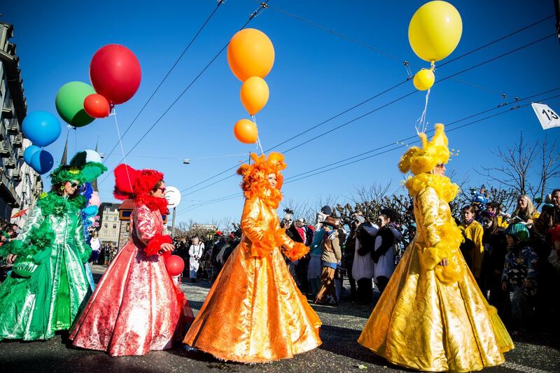 Women in costumes perform during the carnival parade (Fritschi Umzug) in Lucerne, Switzerland. Getty Images