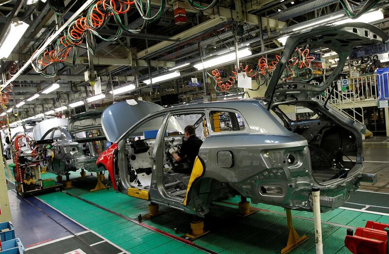 FILE PHOTO: A man works on the production line at the Toyota factory in Derby, central England, March 7, 2011.   REUTERS/Darren Staples/File Photo