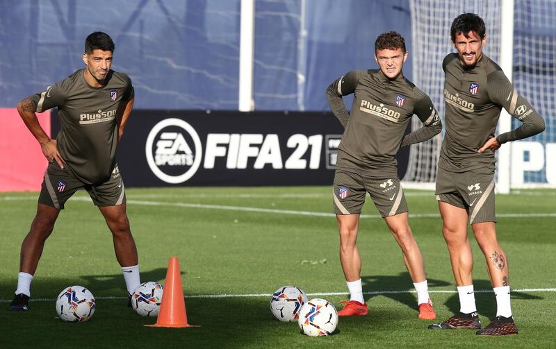 Luis Suarez trains after signing for Atletico Madrid with Kieran Trippier and Stefan Savic. Reuters