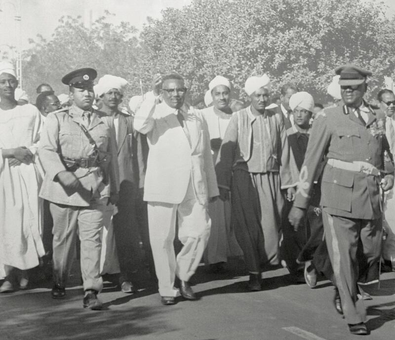 (Original Caption) Ismail El Azhary, Prime minister of the Sudan, is shown (center) as he walked to Gordon Square, near the Governor's palace in Khartoum to make the formal proclamation of the Indepence of the Sudan. An agreement between Egypt and Britain in 1953 provided for liquidation of the Anglo-Egyptian administration and the determination on either union of the Sudan with Egypt or complete independence. the Sudanese decided on independence.