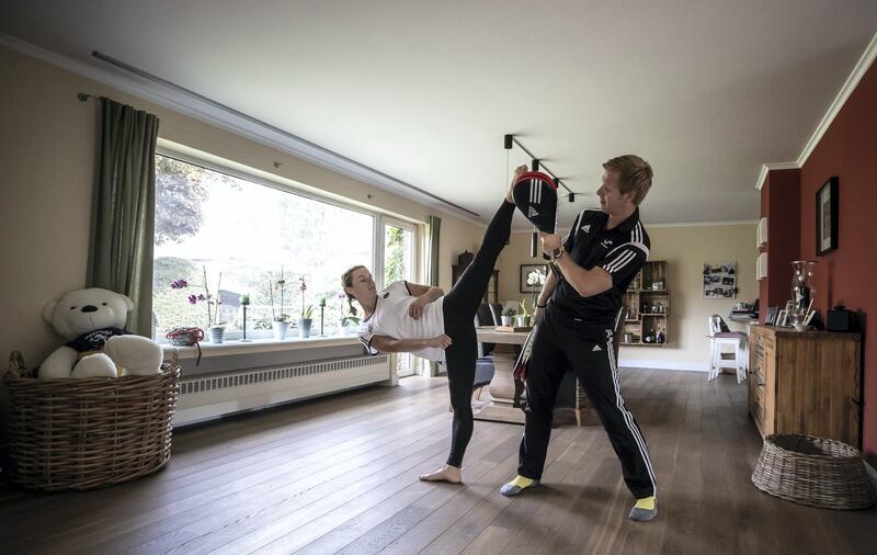 NETTETAL, GERMANY - APRIL 30: Taekwondo athlete Madeline Folgmann trains with her coach Bjoern Pistel at home on April 30, 2020 in Nettetal, Germany. Athletes across the country are now training in isolation under strict policies in place due to the Covid-19 pandemic. (Photo by Lars Baron/Bongarts/Getty Images)