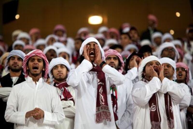 Al Wahda supporters, above, cheer on their players, but they ended up on the losing side against a powerful Al Jazira.