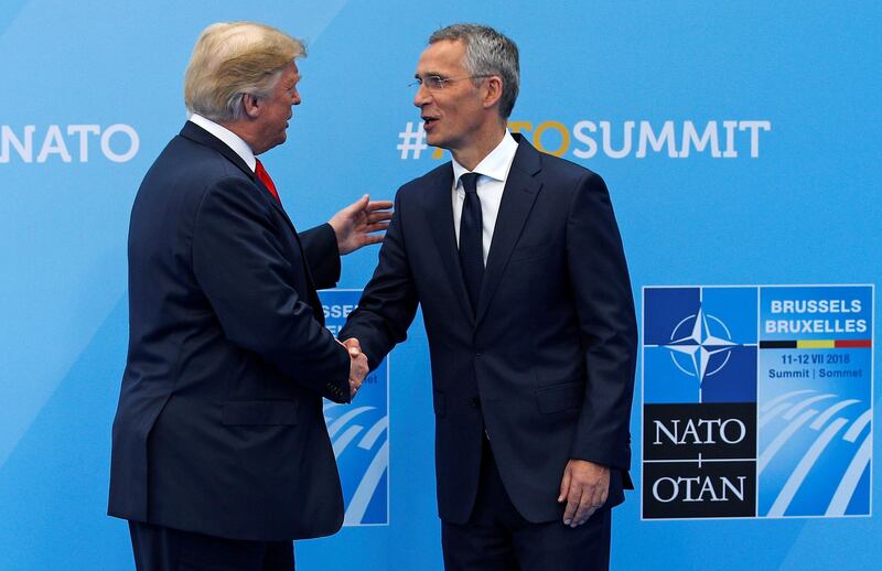 U.S. President Donald Trump is greeted by NATO Secretary General Jens Stoltenberg before a summit of heads of state and government at NATO headquarters in Brussels, Belgium, July 11, 2018. Francois Mori/ Pool via REUTERS