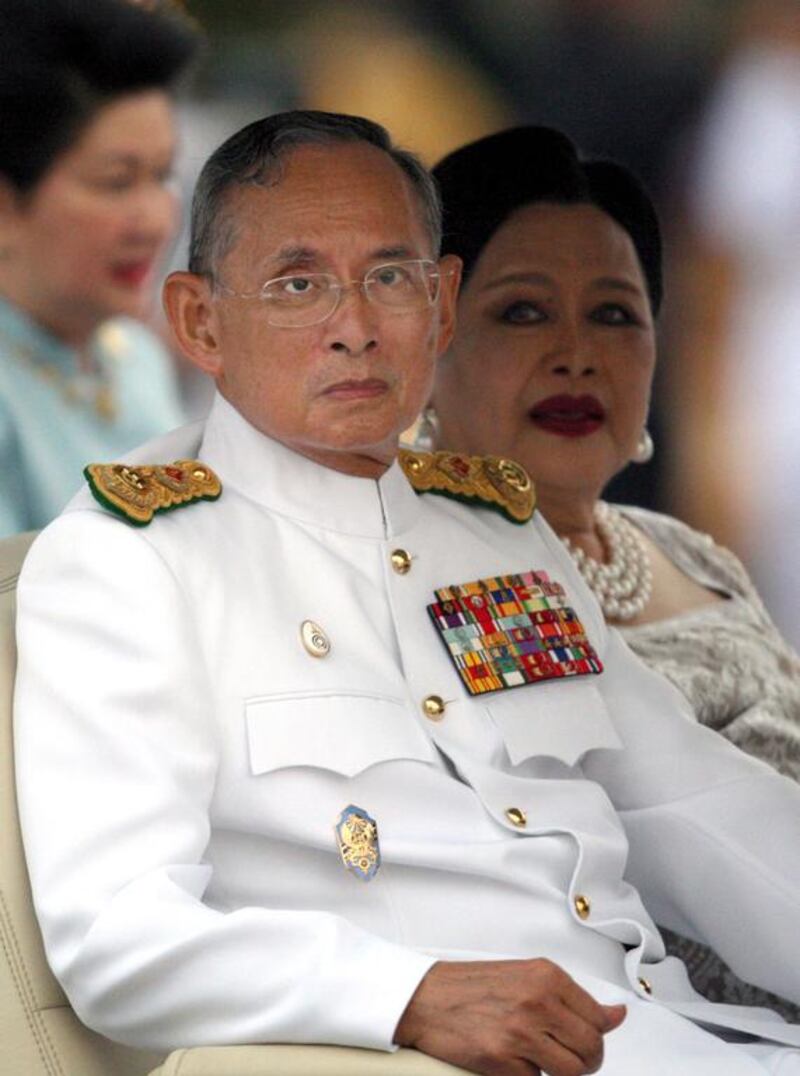 The monarch, left, and Queen Sirikit at Sanam Luang in Bangkok on October 20, 2008. Rungroj Yongrit/EPA