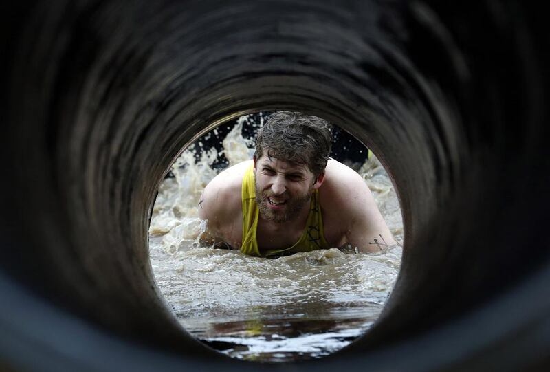 A competitor participates in the Tough Mudder challenge near Winchester in southern England on Saturday. Luke MacGregor / Reuters