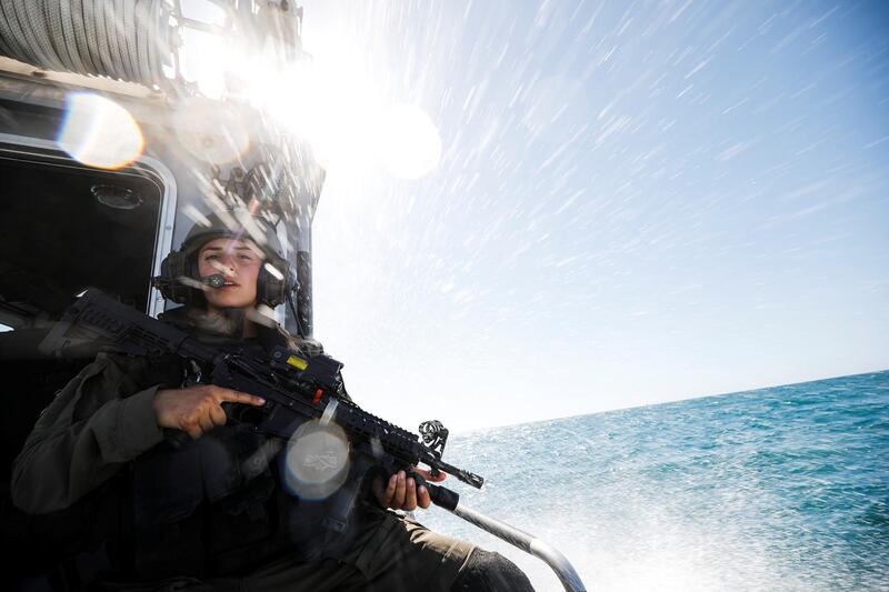 An Israeli soldier stands on her naval boat while patrolling the Mediterranean Sea off the southern Israeli coast as Israel-Gaza fighting rages. Reuters