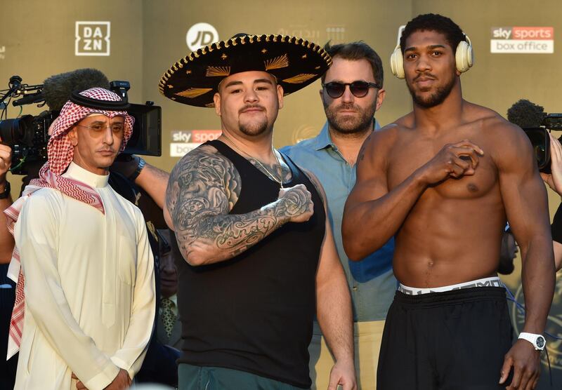 Andy Ruiz Jr (L) and British heavyweight boxing challenger Anthony Joshua pose during the official weigh-in. AFP