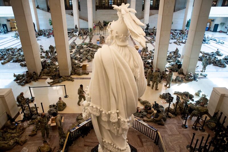 Hundreds of US National Guard troops rest in the Capitol Visitors Center, with the Statue of Freedom seen at center, on Capitol Hill in Washington, DC, USA. EPA
