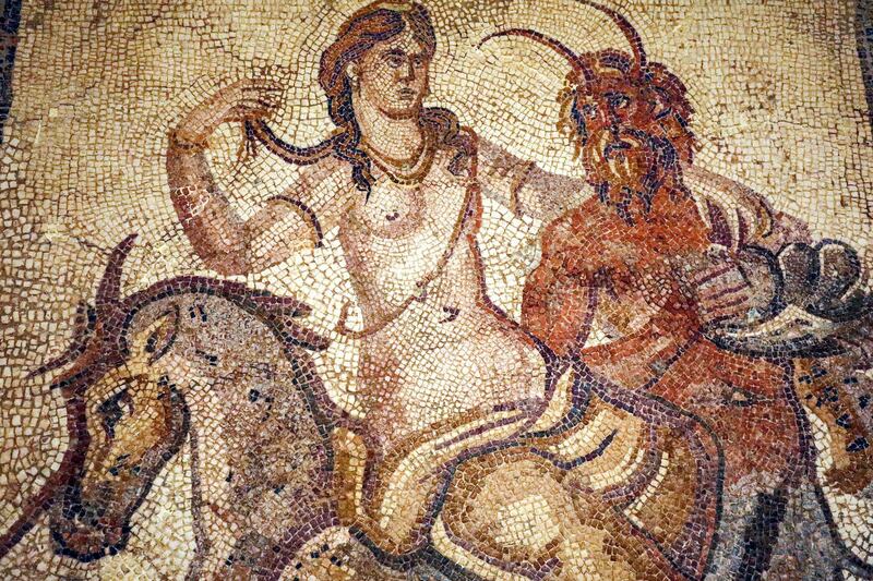 A view of a mosaic of a nymph and satyr from the villa of Jason Magnus at the Cyrene Museum in the eastern Libyan town of Shahat, near the ruins of the ancient city of Cyrene.  AFP