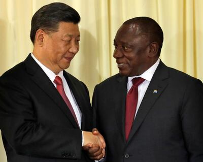 South African President Cyril Ramaphosa, right, shakes hand with Chinese President Xi Jinping after a joint press conference at the government's Union Buildings in Pretoria, South Africa, Tuesday, July 24, 2018. Jinping is in the country to attend the three-day BRICS Summit starting Wednesday in Johannesburg. (AP Photo/Themba Hadebe)