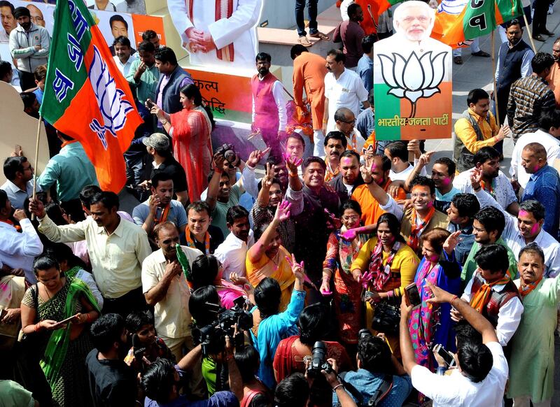 epa06577180 Bharatiya Janata Party (BJP) supporters celebrate BJP's emphatic performance and win in Tripura state assembly election results, in New Delhi, India, 03 March 2018. BJP is set to form the next government, winning absolute majority in assembly elections in Tripura with its ally Indigenous People's Front of Tripura (IPFT). Communist Party of India (Marxist) or CPI (M) government has ruled the Tripura state for the last 25 years.  EPA/STR