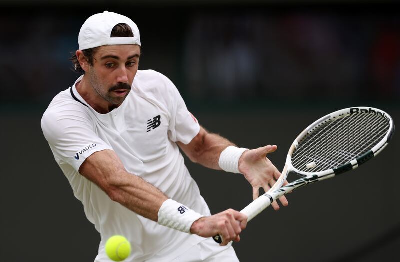 Jordan Thompson of Australia plays a backhand against Stefanos Tsitsipas of Greece. Getty 