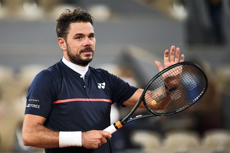 Switzerland's Stanislas Wawrinka celebrates after winning against Britain's Andy Murray during their men's singles first round tennis match on Day 1 of The Roland Garros 2020 French Open tennis tournament in Paris on September 27, 2020. (Photo by Anne-Christine POUJOULAT / AFP)