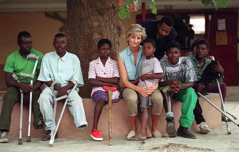 LUANDA, ANGOLA - JANUARY 14:  Diana, Princess Of Wales, With Children Injured By Mines At Neves Bendinha Orthopaedic Workshop In Luanda, Angola.  (Photo by Tim Graham Photo Library via Getty Images)