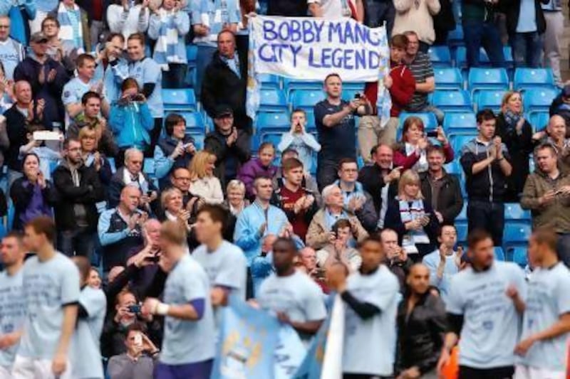 A Roberto Mancini banner is displayed by fans at Etihad Stadium on Sunday. Paul Thomas / Getty Images