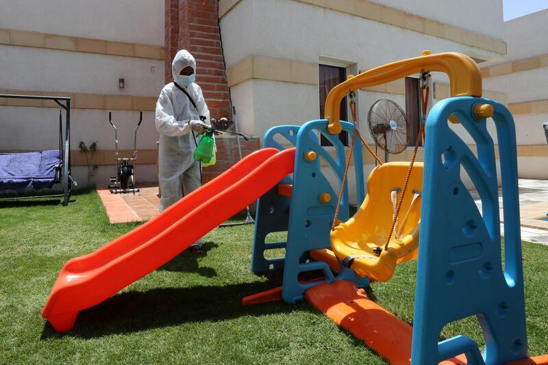 A worker wearing a protective suit sterilises a playground before it’s used by Saudi families, after the government lifted coronavirus restrictions, in Riyadh, Saudi Arabia. Reuters