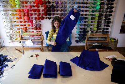 Brooke Dennis is seen at work as she volunteers making scrubs for the NHS at her business Make Town in Hackney, as the spread of the coronavirus disease (COVID-19) continues, London, Britain, April 13, 2020. REUTERS/David Klein     TPX IMAGES OF THE DAY