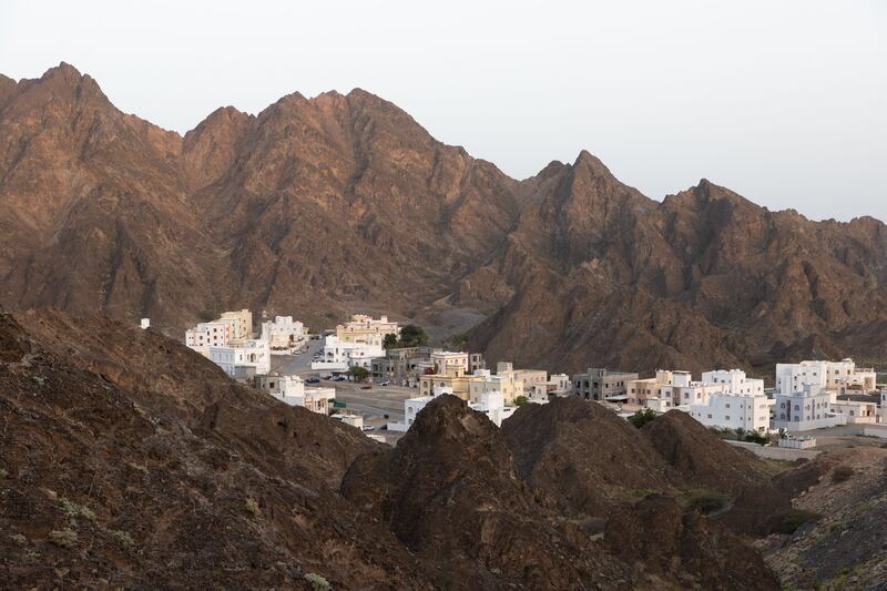 A backdrop of craggy mountains surrounds the luxury retreat.