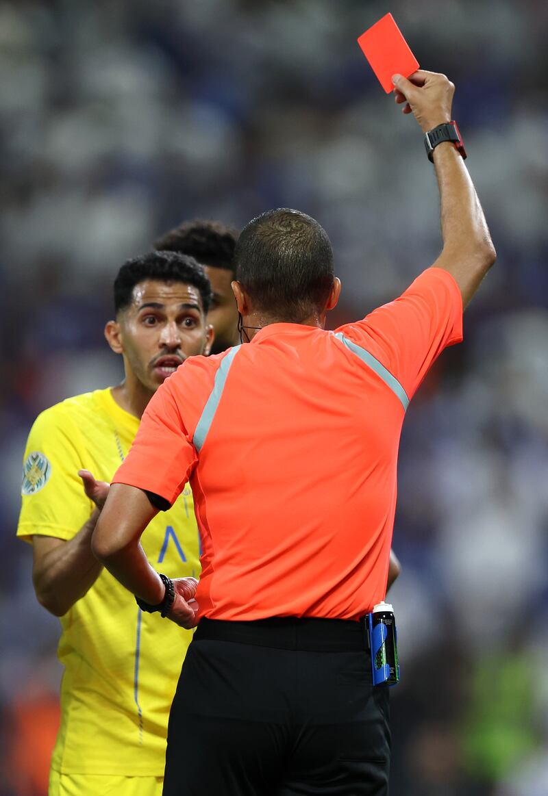 Referee Redouane Jiyed shows a red card to Abdulelah Al Amri of Al Nassr. Getty
