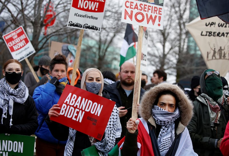 Protestors rally for a cease fire in Gaza outside a UAW union hall during a visit by U. S.  President Joe Biden in Warren, Michigan. Reuters