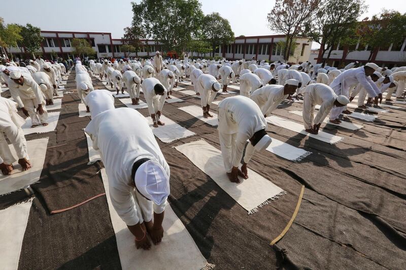 Inmates of the Central Jail take part in a mass yoga session on the occasion of the 4th International Day of Yoga in Bhopal, India. Sanjeev Gupta / EPA