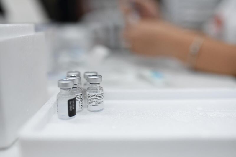 Vials of the Pfizer-BioNTech coronavirus vaccine stand on a table in an assisted living community in Pisgat Ze'ev, an Israeli settlement in occupied East Jerusalem.