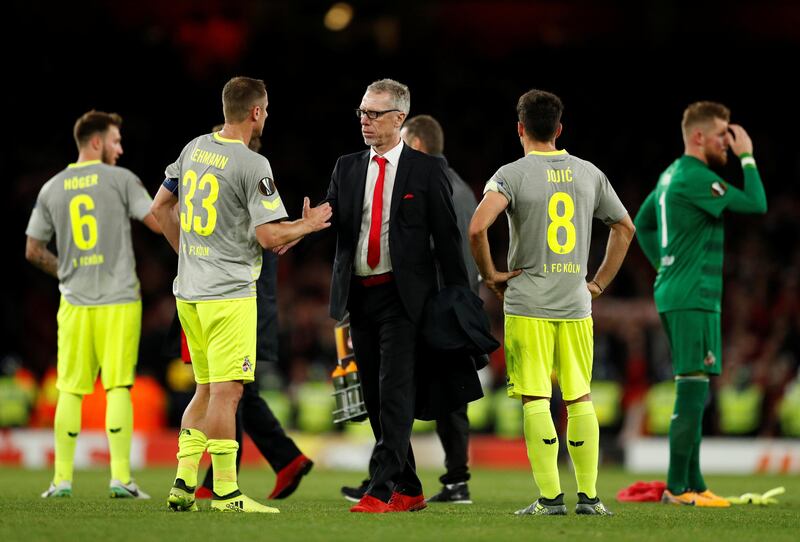 Cologne manager Peter Stoger and Mathias Lehmann at the end of the match. John Sibley / Reuters