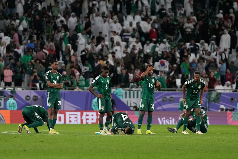 Saudi Arabia players after losing in the penalty shootout. AP