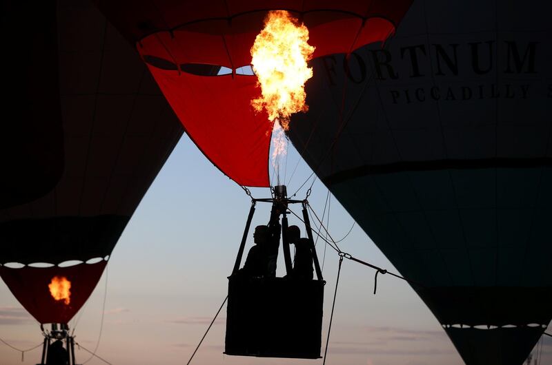 Hot air balloons are seen during a tethered flight at the Bristol International balloon fiesta. REUTERS