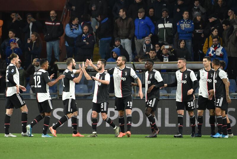 Juventus players celebrate after Paulo Dybala netted their first goal. Getty