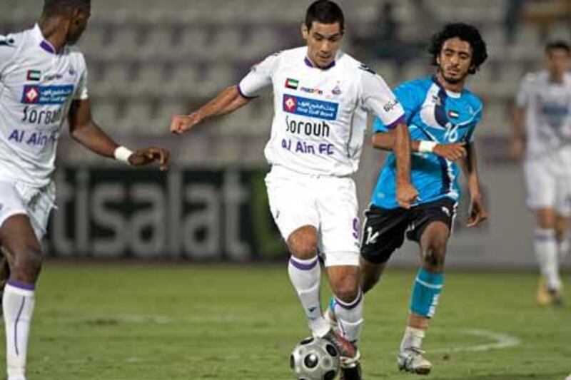 Jose Sand, the Al Ain striker, dribbles through the Baniyas defence.