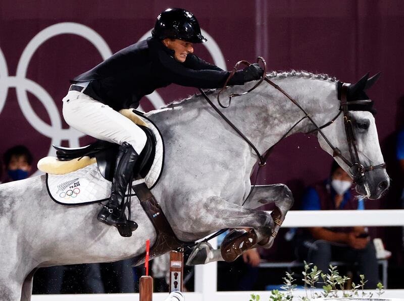 Daniel Meech of New Zealand on Cinca 3 competes in the jumping individual qualifier.