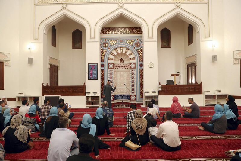 Dubai, United Arab Emirates - June 5th, 2018: Moeen Murad talks to people about the muslim faith at Diwan Mosque. Ramadan cultural night and Iftar at the Sheikh Mohammed Centre for Cultural Understanding. Tuesday, June 5th, 2018 at Sheikh Mohammed Centre for Cultural Understanding, Dubai. Chris Whiteoak / The National