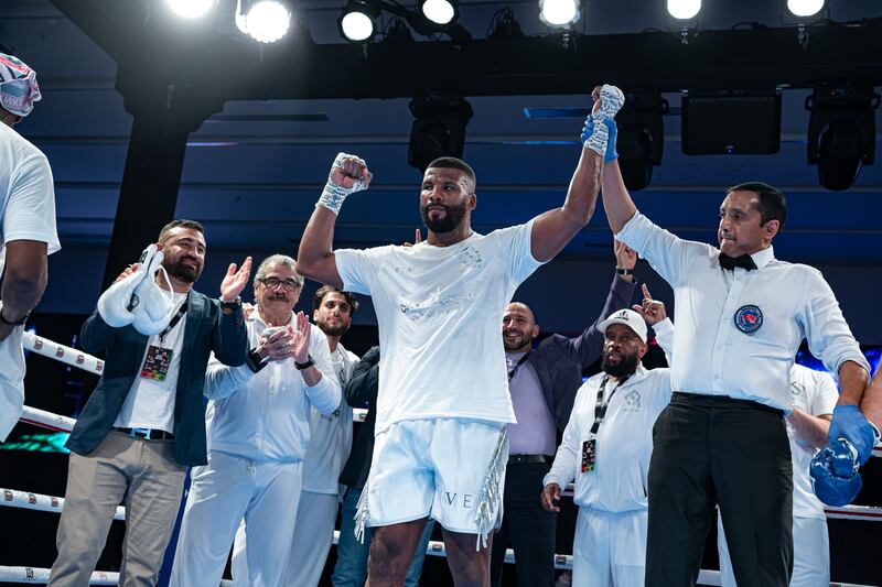 Badou Jack with his hand raised in victory.