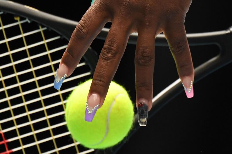 Serena Williams of the US practices her serve before her women's singles match against China's Wang Qiang in Melbourne. AFP