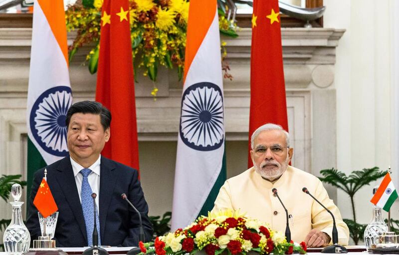 India's prime minister, Narendra Modi, and China's president, Xi Jinping, in Delhi. Graham Crouch / Bloomberg