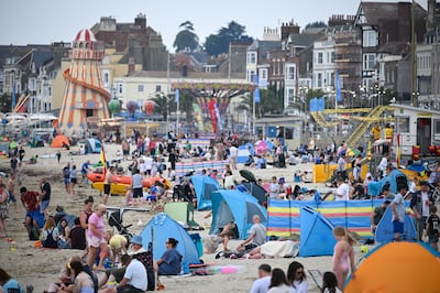 A busy Weymouth beach in southern England. A heatwave in Britain has apparently led to a surge in the use of air conditioning. Getty