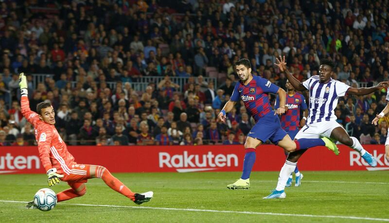 Barcelona striker Luis Suarez (C) scores during a La Liga match against Real Valladolid at the Camp Nou stadium.  EPA/ENRIC FONTCUBERTA