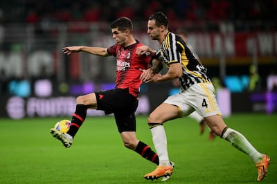 AC Milan's American forward Christian Pulisic, left, pictured in their 1-0 defeat to Juventus at the weekend. AFP