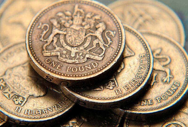 FILE PHOTO: A pile of one pound coins is seen in a photo illustration shot June 17, 2008.  REUTERS/Toby Melville/Illustration/File Photo