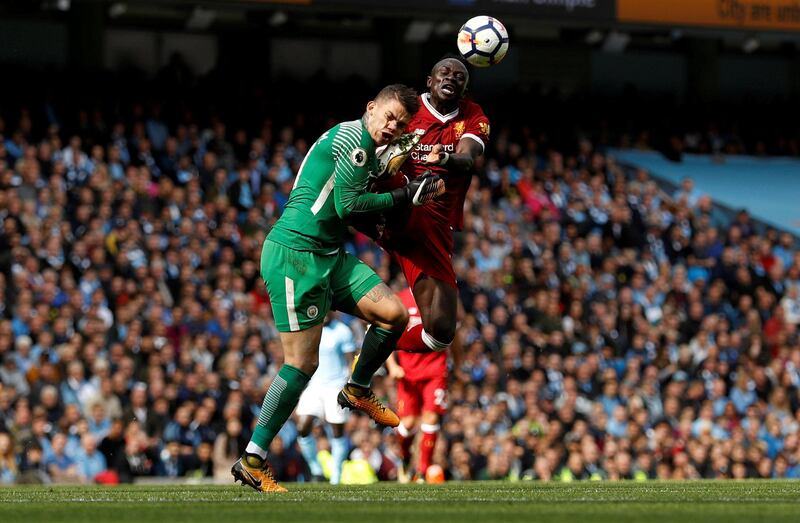 Soccer Football - Premier League - Manchester City vs Liverpool - Manchester, Britain - September 9, 2017   Manchester City’s Ederson Moraes is fouled by Liverpool's Sadio Mane resulting in a red card for Mane   Action Images via Reuters/Lee Smith  EDITORIAL USE ONLY. No use with unauthorized audio, video, data, fixture lists, club/league logos or "live" services. Online in-match use limited to 75 images, no video emulation. No use in betting, games or single club/league/player publications. Please contact your account representative for further details.