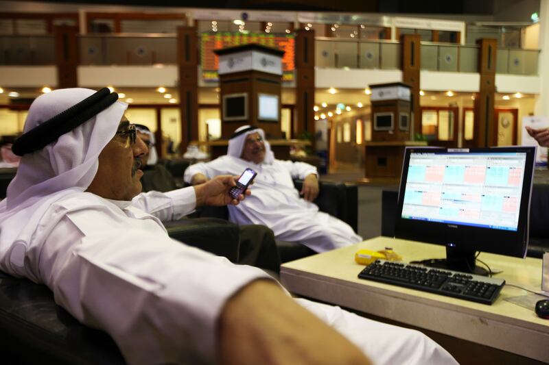 DUBAI , UNITED ARAB EMIRATES  Ð  Jan 17 : Traders monitoring the stock indicators at the Dubai Financial Market in Dubai. ( Pawan Singh / The National ) For Business Stock.
