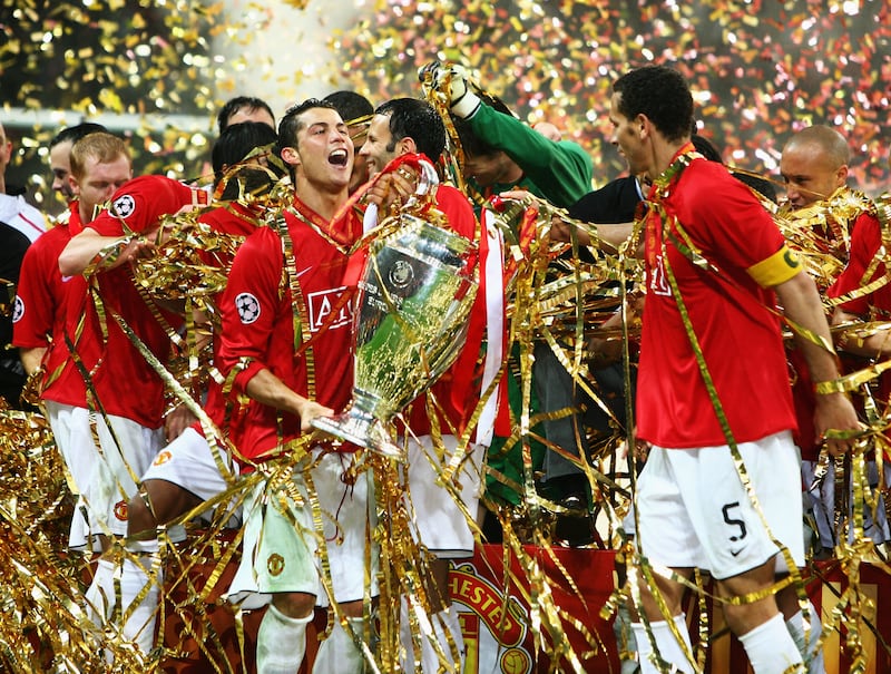 Cristiano Ronaldo and his Manchester United teammates celebrate with the Champions League trophy after defeating Chelsea in the final in 2008 in Moscow. They won in a penalty shootout after a 1-1 draw. Ronaldo made his way back to Old Trafford after leaving Juventus. Getty Images