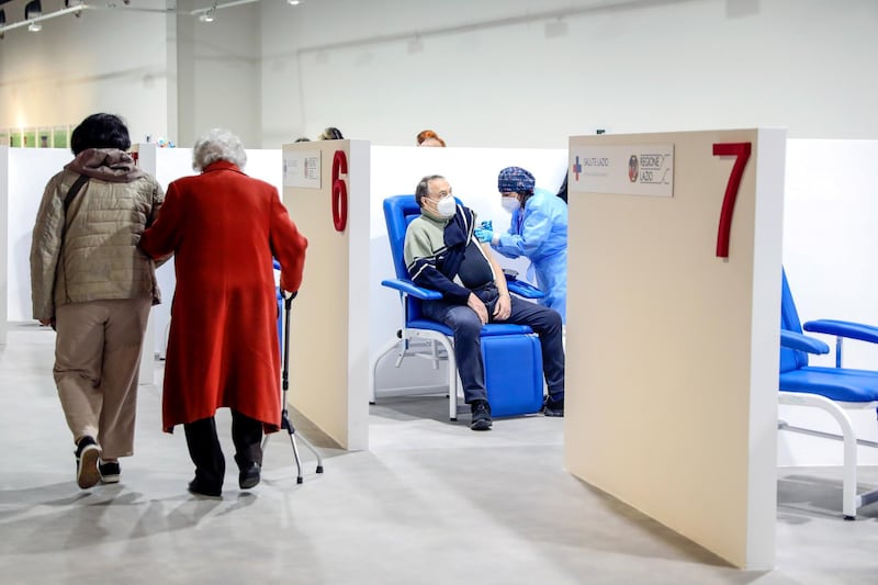 A health worker administers the Moderna vaccine at a Covid-19 vaccination centre in Rome, Italy. Bloomberg