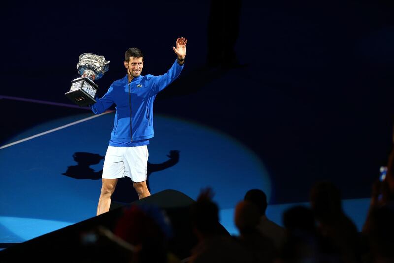 Novak Djokovic takes part in a lap of honour after his win. Getty Images